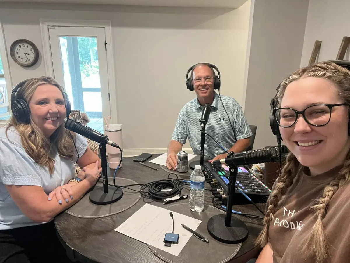 Lisa, Rex and Eva Davis around the recording table in headphones